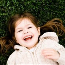 The Benefits of Weighted Vests for Autism: Do They Really Work? Autistic girl laughing